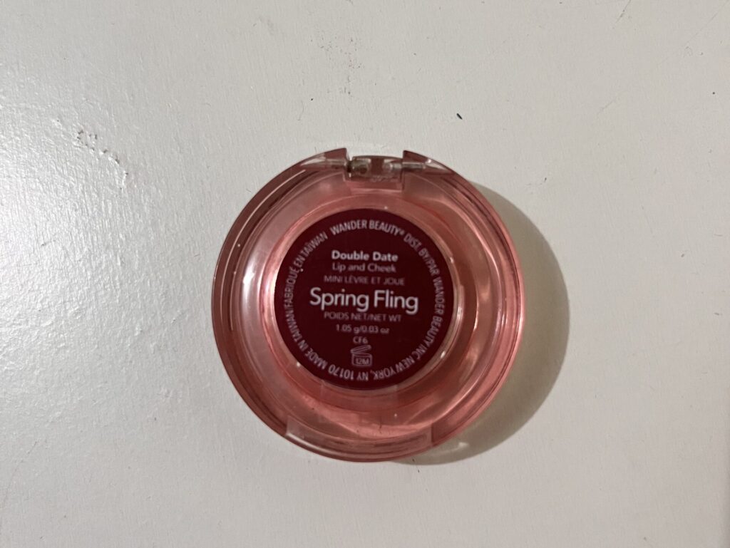 Back of Wander Beauty mini Double Date Lip and Cheek Spring Fling showing shade name and 1.08 g weight