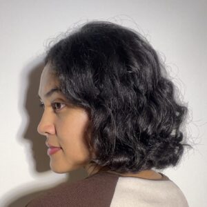 Side back view of curly hair after 5 hours of using Moroccan Hydrating Elastin Curl Cream