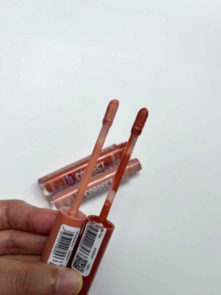 Two shades of Essence Correct & Conceal Under Eye Brightening concealer with doe-foot applicators on a white background