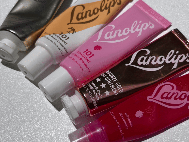 Lanolips balm collection arranged on a clean white background in natural sunlight.