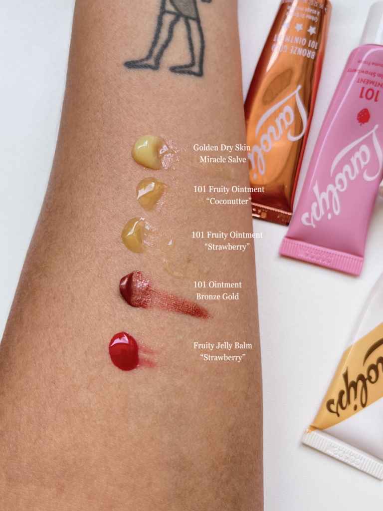 Lanolips ointment and tinted balm hand swatch before blending to show texture and finish