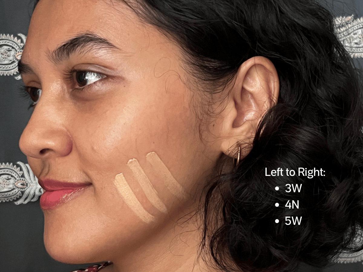 Kosas Revealer Concealer shades 03W, 04N, and 05W swatched on a jawline with medium neutral-to-warm skin and golden undertones.