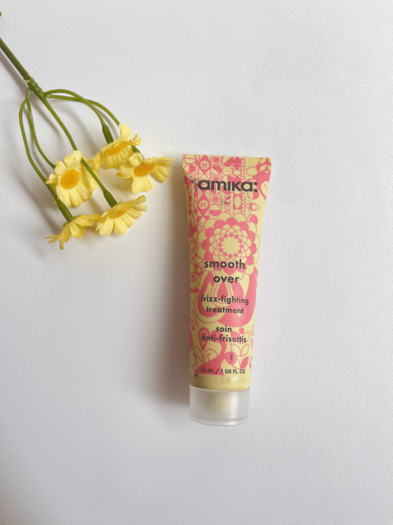 amika Smooth Over Frizz-Fighting Treatment tube with yellow flowers